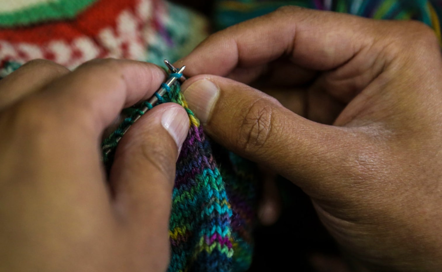 Pedro Gonzalez of Dallas knits a sock at Holley's Yarn Shoppe in Dallas. He can knit a sock...