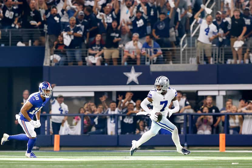 Dallas Cowboys cornerback Trevon Diggs (7) returns an interception on a pass intended for...