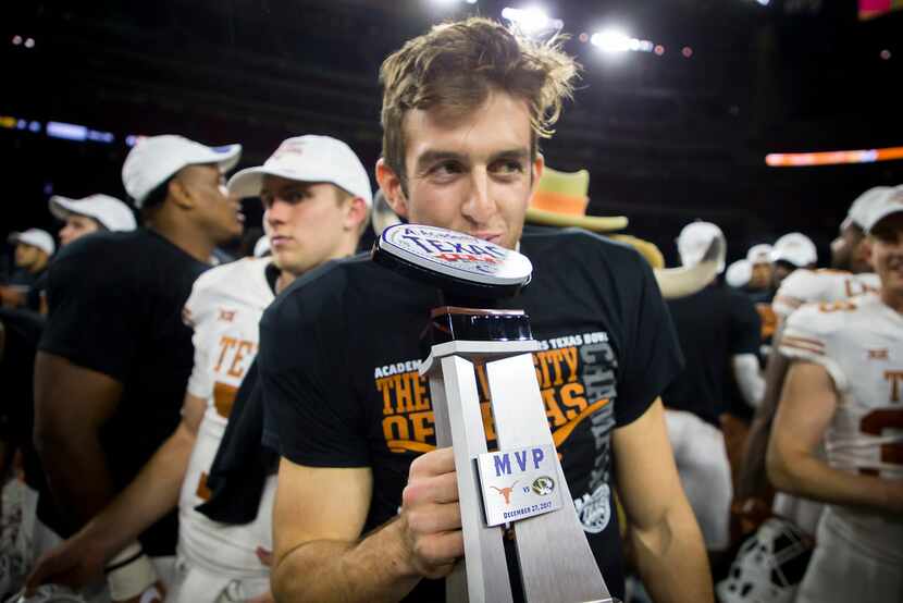 FILE - Texas punter Michael Dickson celebrates with the game MVP trophy after a win over...