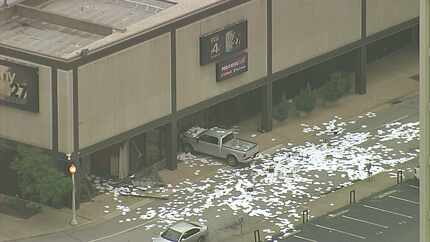 Papers lie scattered after a truck rammed into the Fox4 news studio Wednesday morning in...