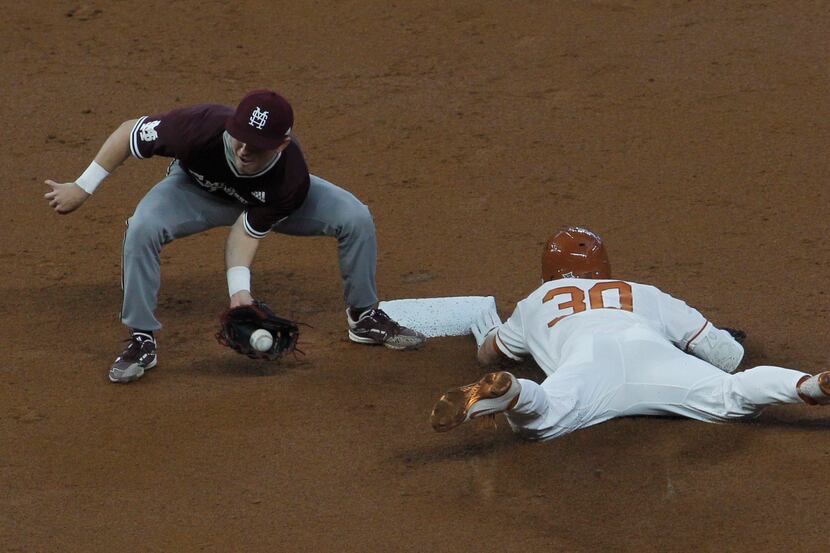 Texas Longhorns outfielder Eric Kennedy (30) safely steals 2nd base as Mississippi State 2nd...