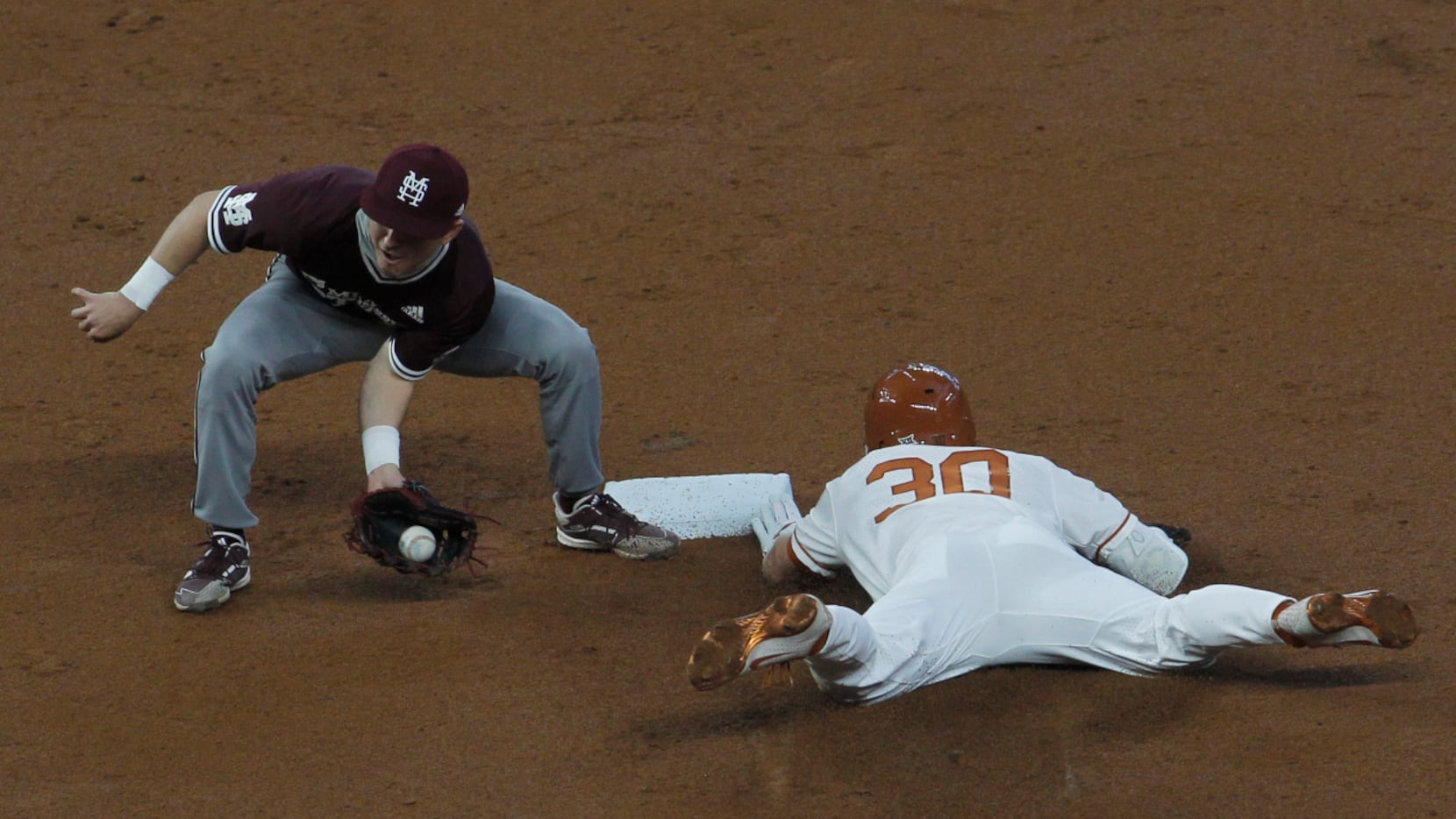 Texas Longhorns outfielder Eric Kennedy (30) safely steals 2nd base as Mississippi State 2nd...