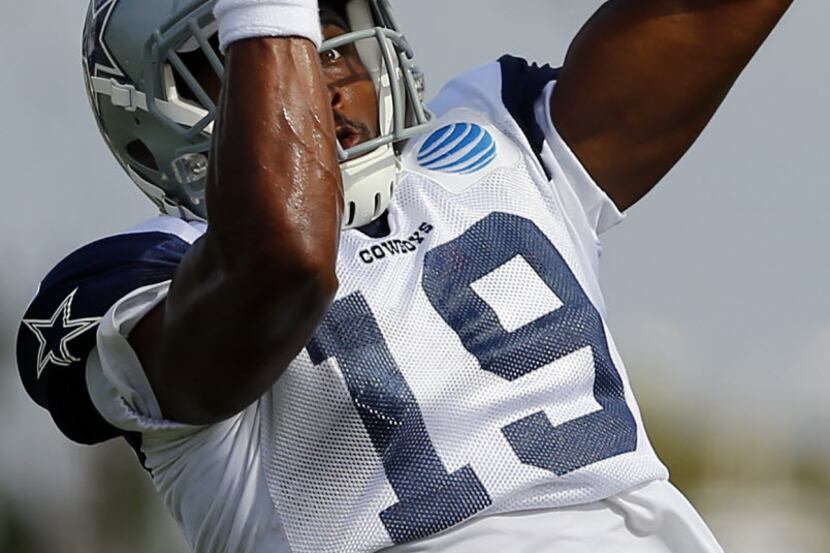 Dallas Cowboys wide receiver Brice Butler (19) pulls in a pass during afternoon practice at...