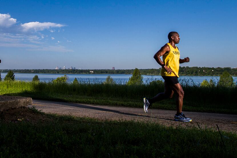 Marathon runner Tony Reed runs on the White Rock Lake Trail on Sunday, April 26, 2015 in...