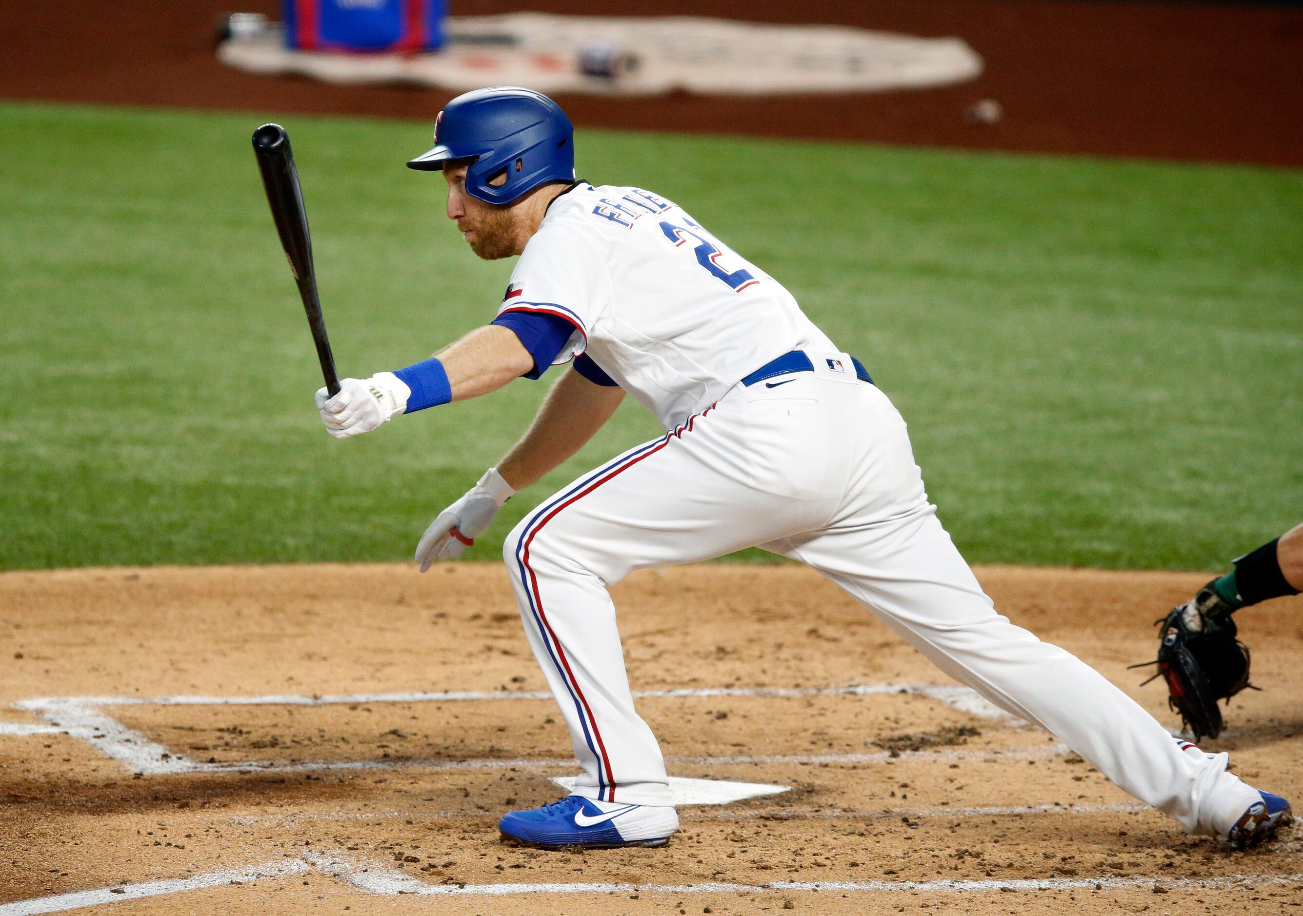 Texas Rangers third baseman Todd Frazier (21) singles to center, scoring Nick Solak and...