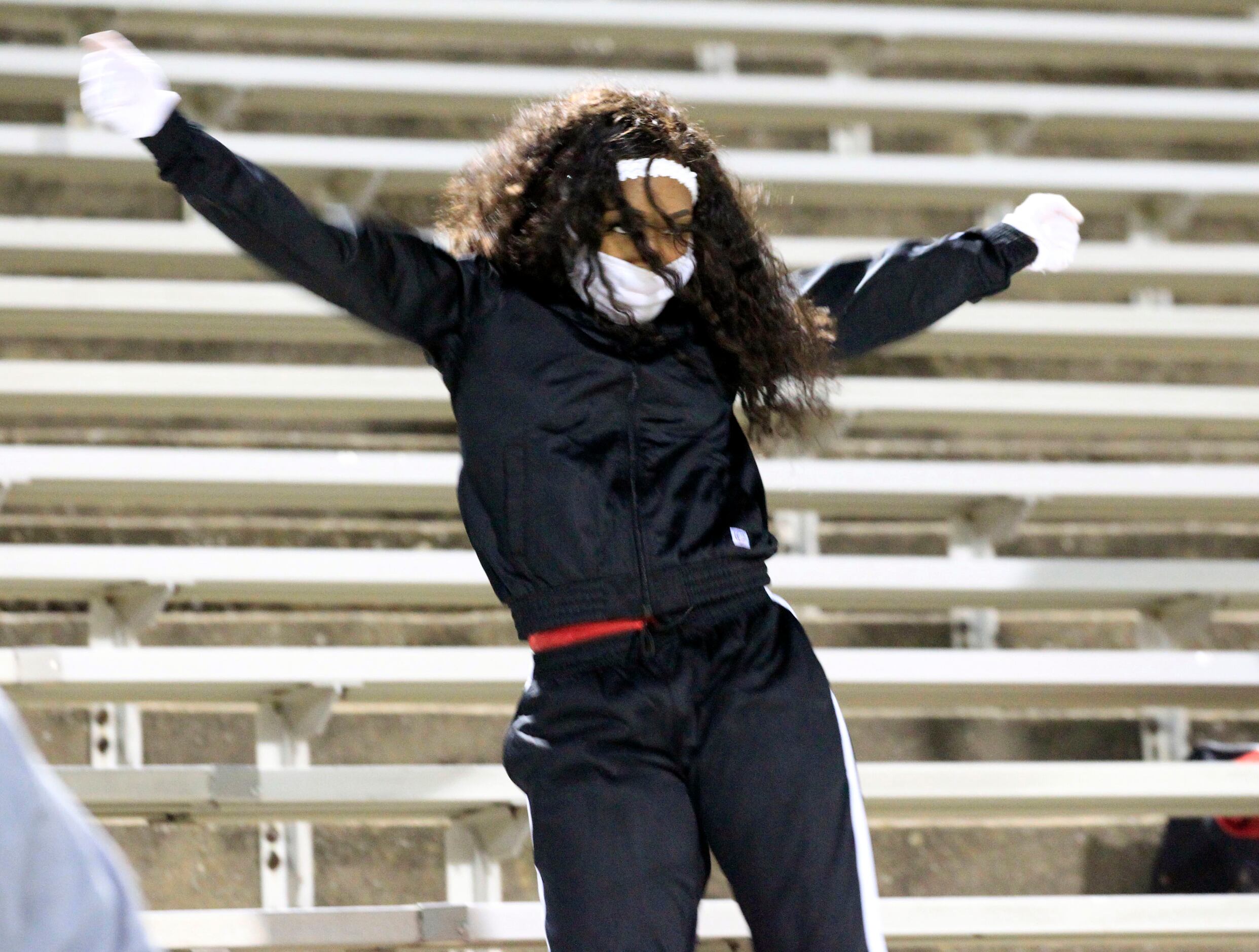 A Skyline performer dances in the stands during the first half of a high school football...