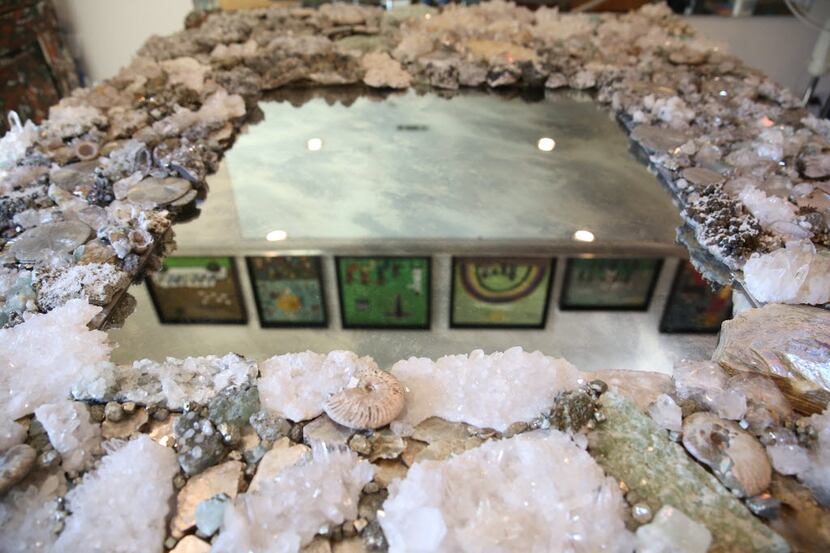 A large mirror of rocks and minerals made by Connie Chantilis 