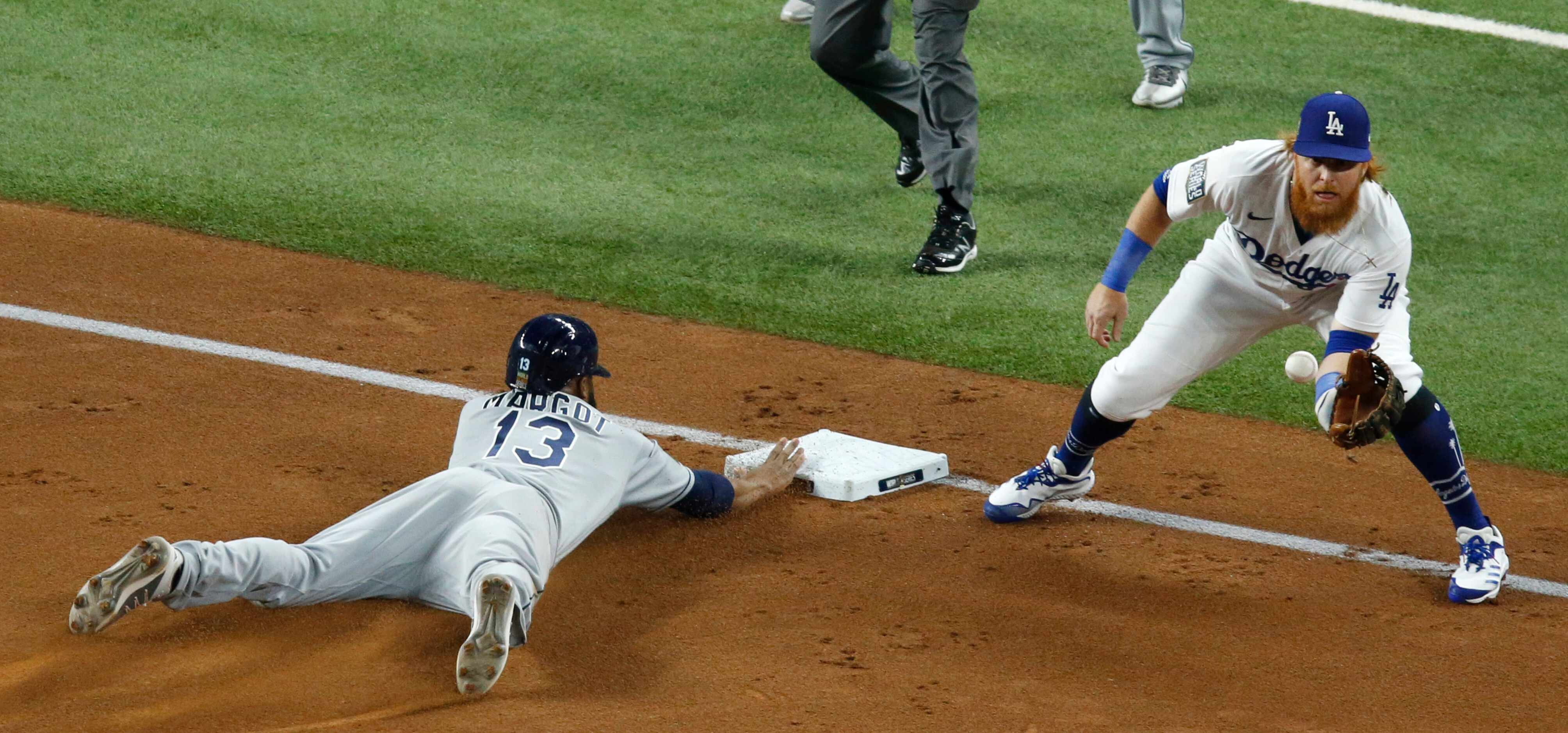 Tampa Bay Rays right fielder Manuel Margot (13) safely slides to third base as Los Angeles...