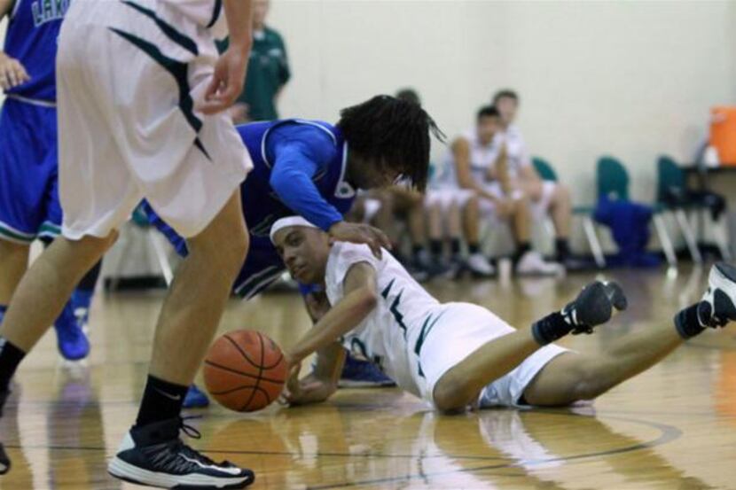 
Canterbury Episcopal’s Zach Rufus fights for the ball  in a game against Lakehill...