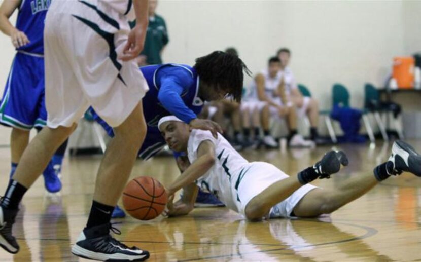 
Canterbury Episcopal’s Zach Rufus fights for the ball  in a game against Lakehill...