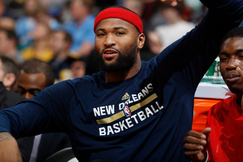 New Orleans Pelicans forward DeMarcus Cousins, left, jokes with forward Cheick Diallo as...