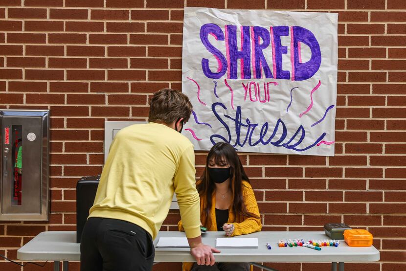 Hope Squad members Sam Simonini and Annalee Jackson worked the "Shred Your Stress" table...