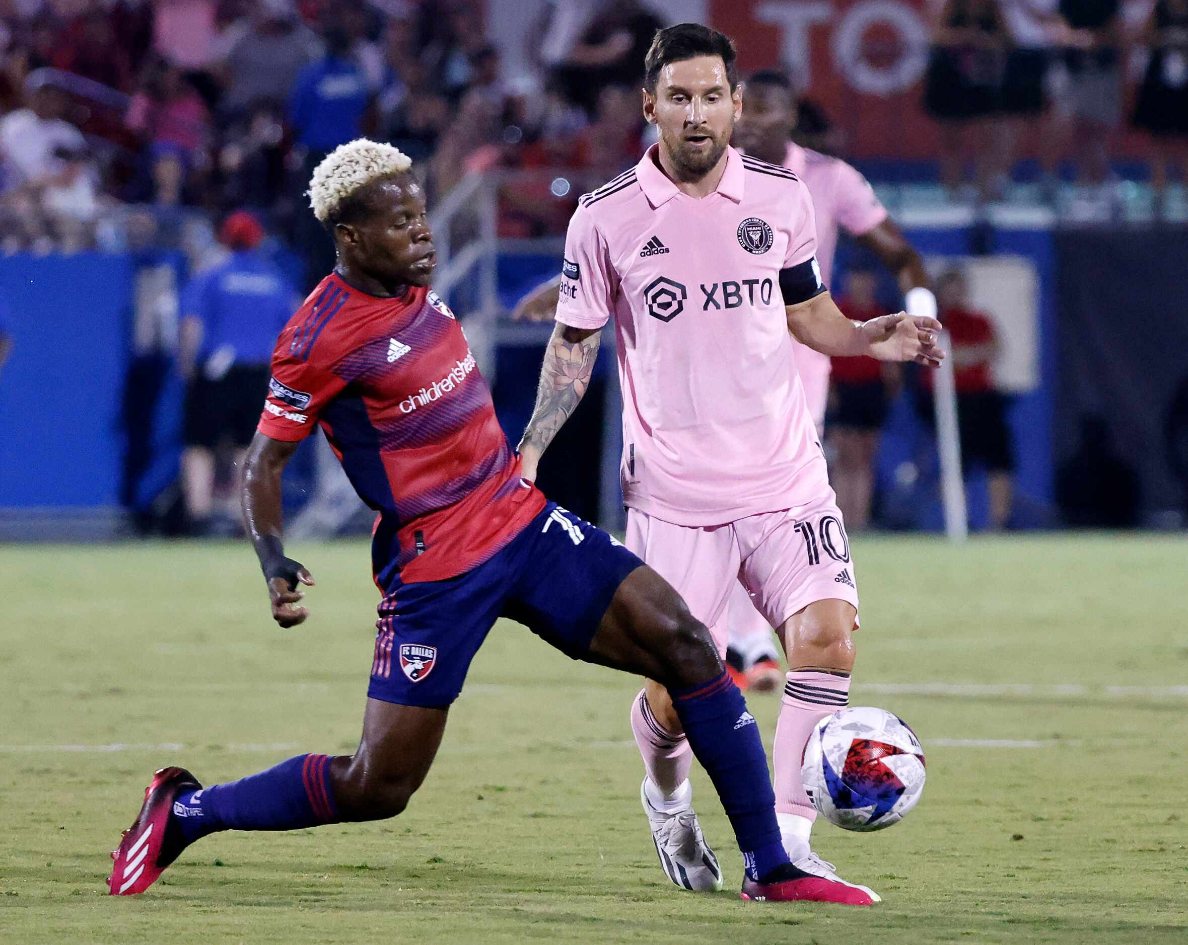 FC Dallas forward Bernard Kamungo (77) slides to take the ball away from Inter Miami forward...