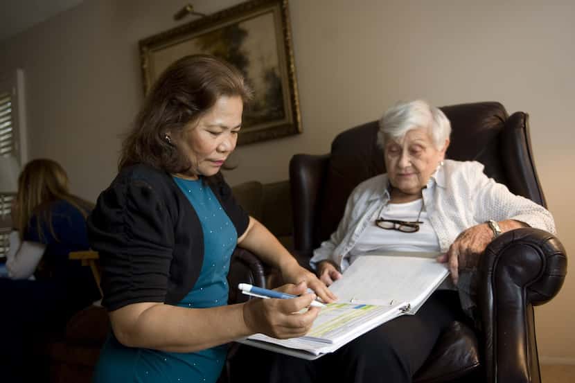 Homecare provider Ellen Evanglista, left, lives with Patricia Miller, 82, right, and helps...