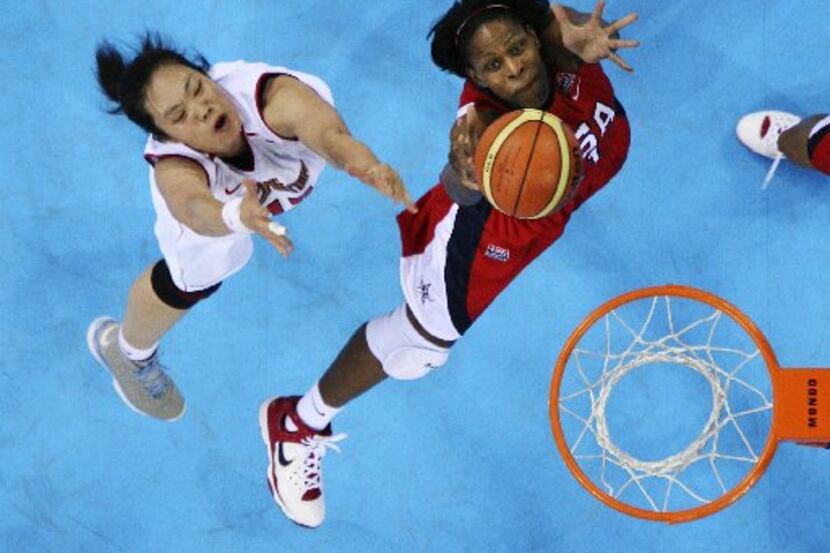 ORG XMIT: *S0423012706* China's Chen Xiaoli goes up for a rebound against Taj McWilliams...