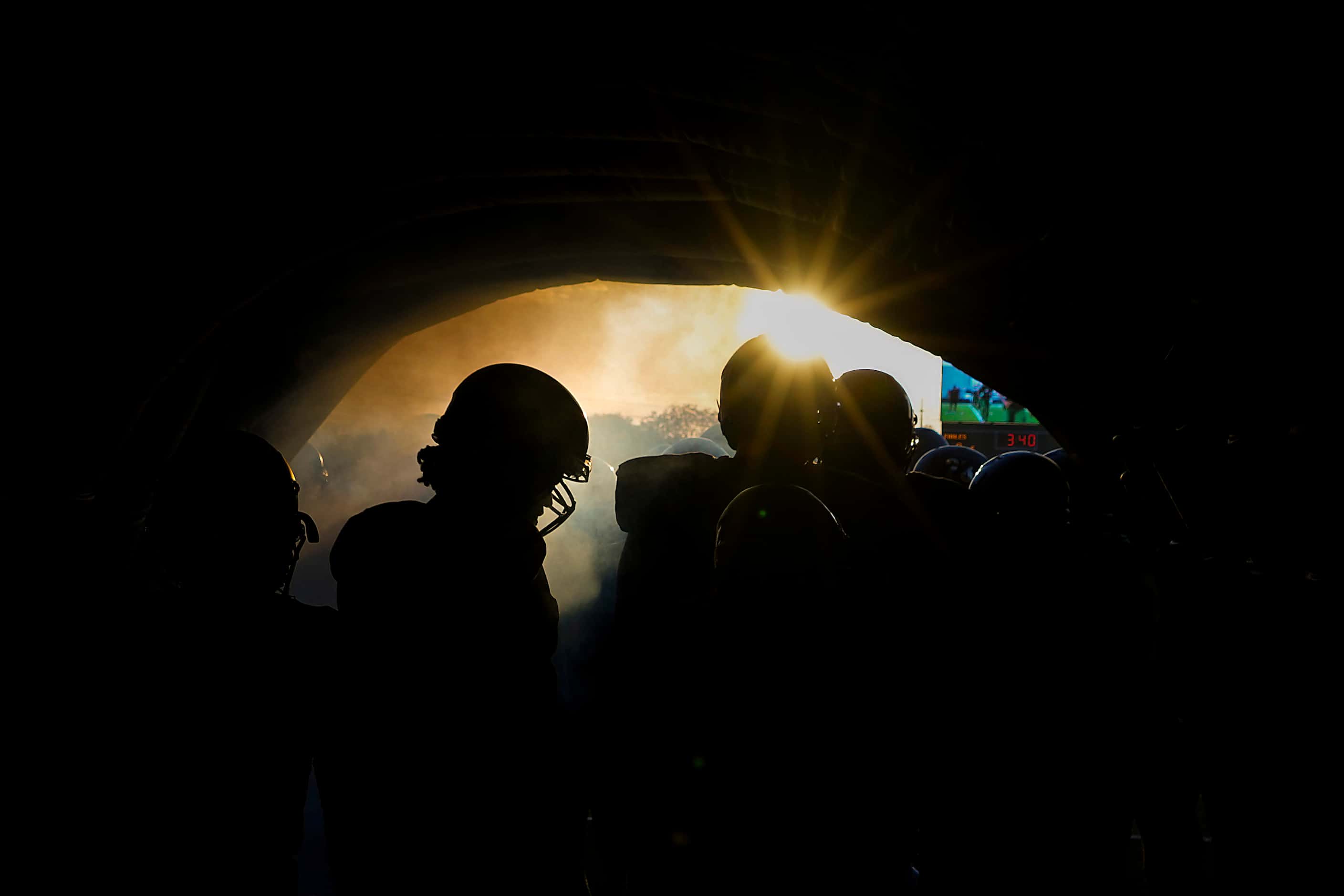 DeSoto players wait in the tunnel to take the field before a high school football game...