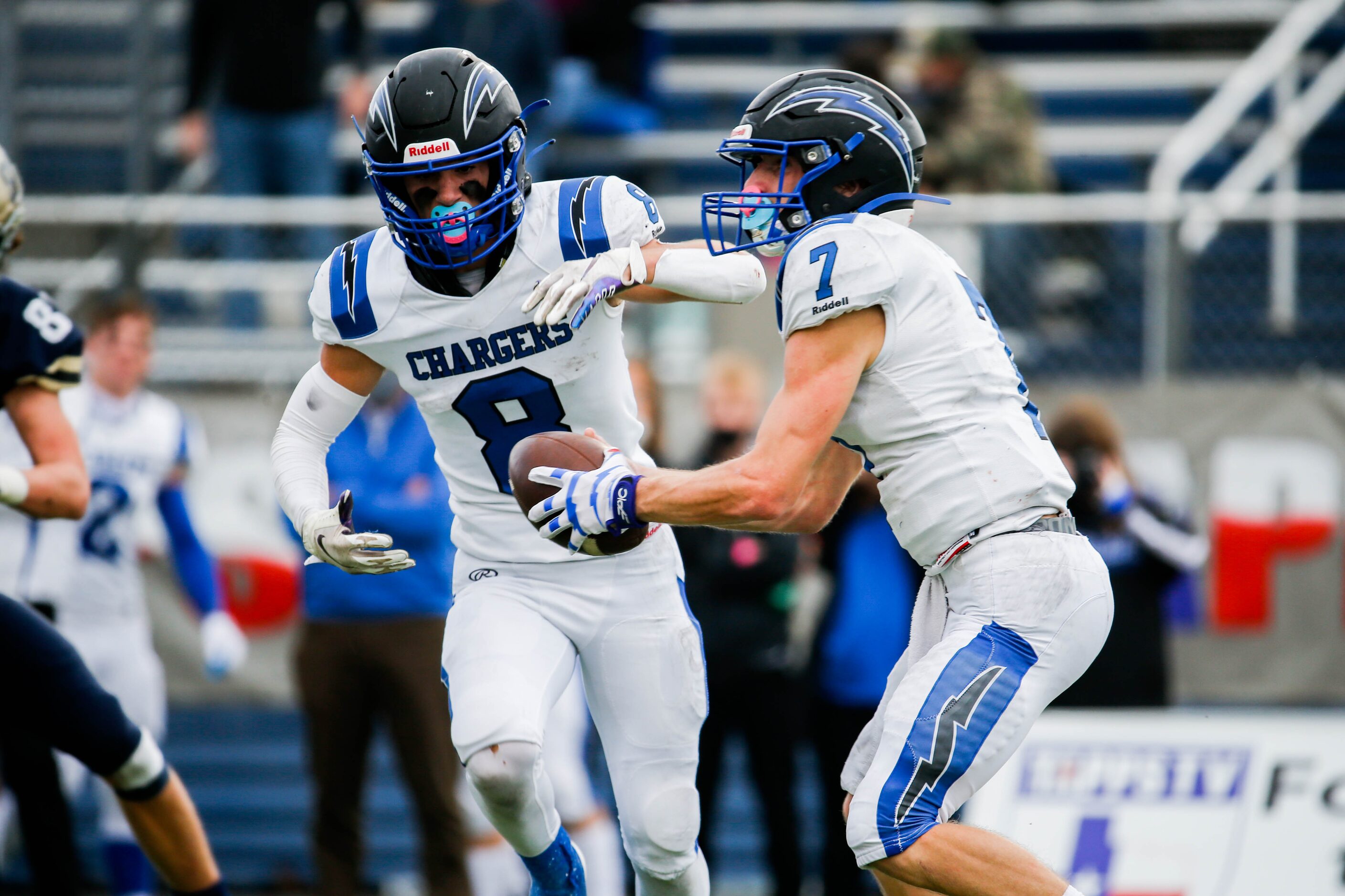 Dallas Christian's quarterback T.J. King (7) fakes a pass to Parker Robertson (8) against...