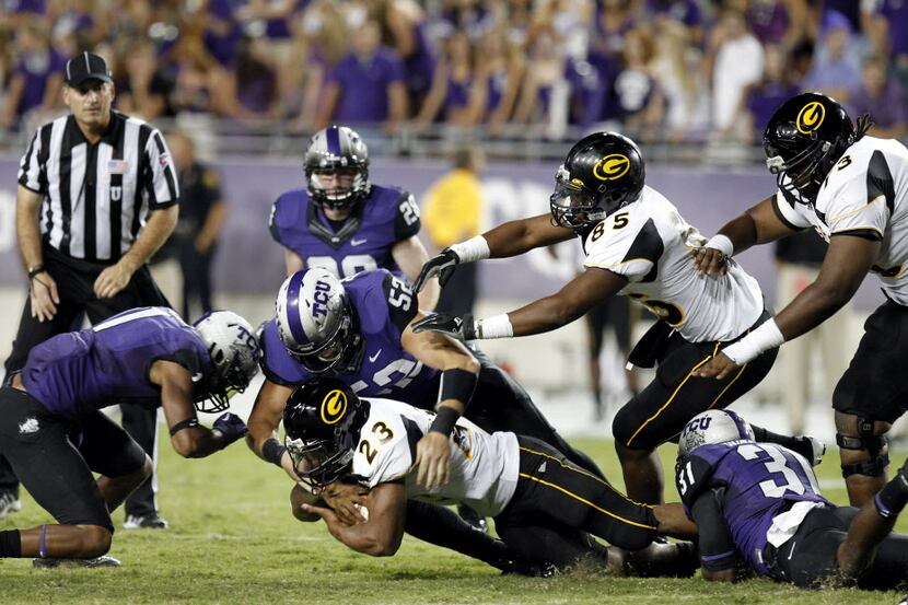 TCU's Ross Forrest (52) takes down Grambling State's Cedric Skinner(23) in the second half...