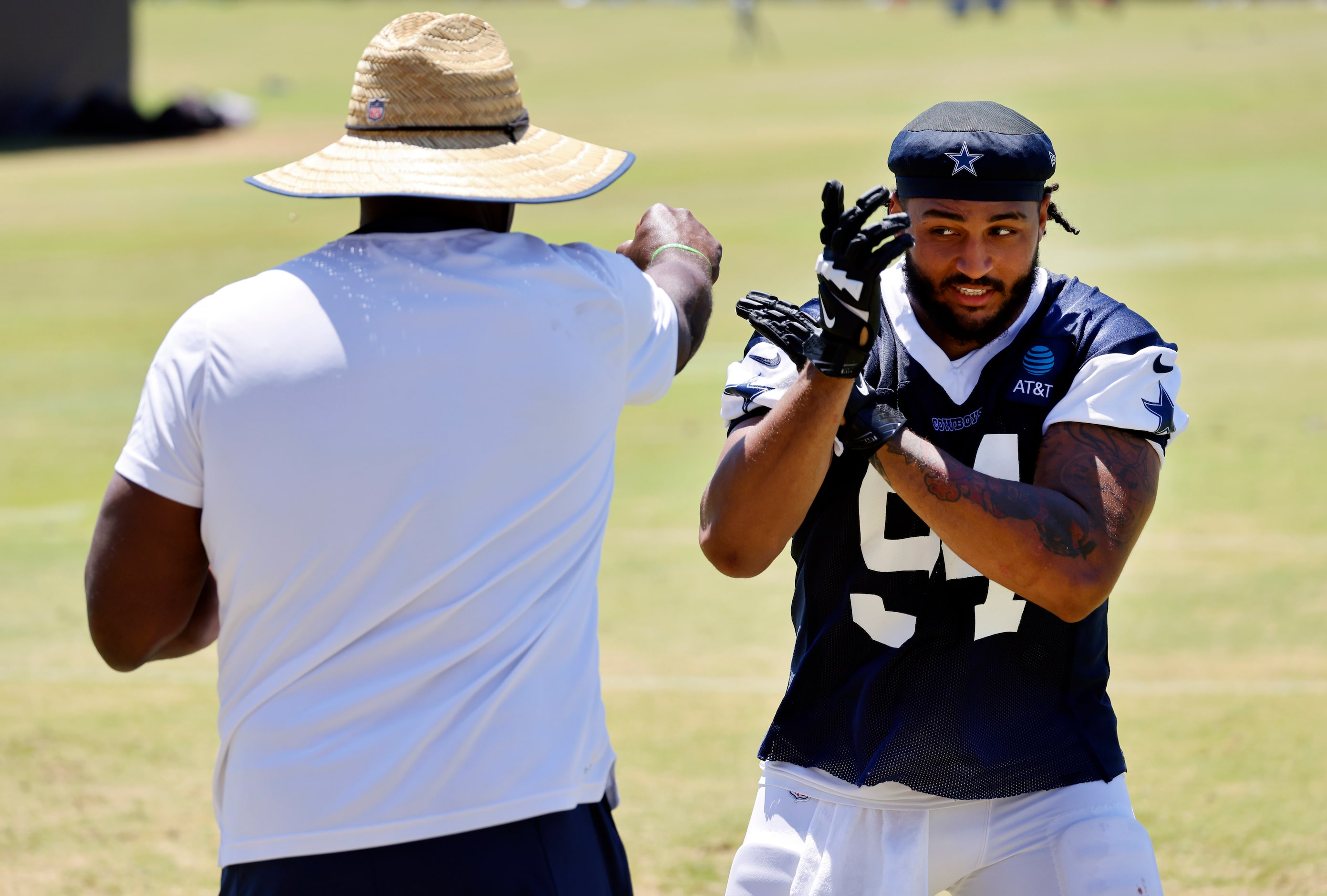 Dallas Cowboys defensive end Marshawn Kneeland (94) works on his pass rushing skills...