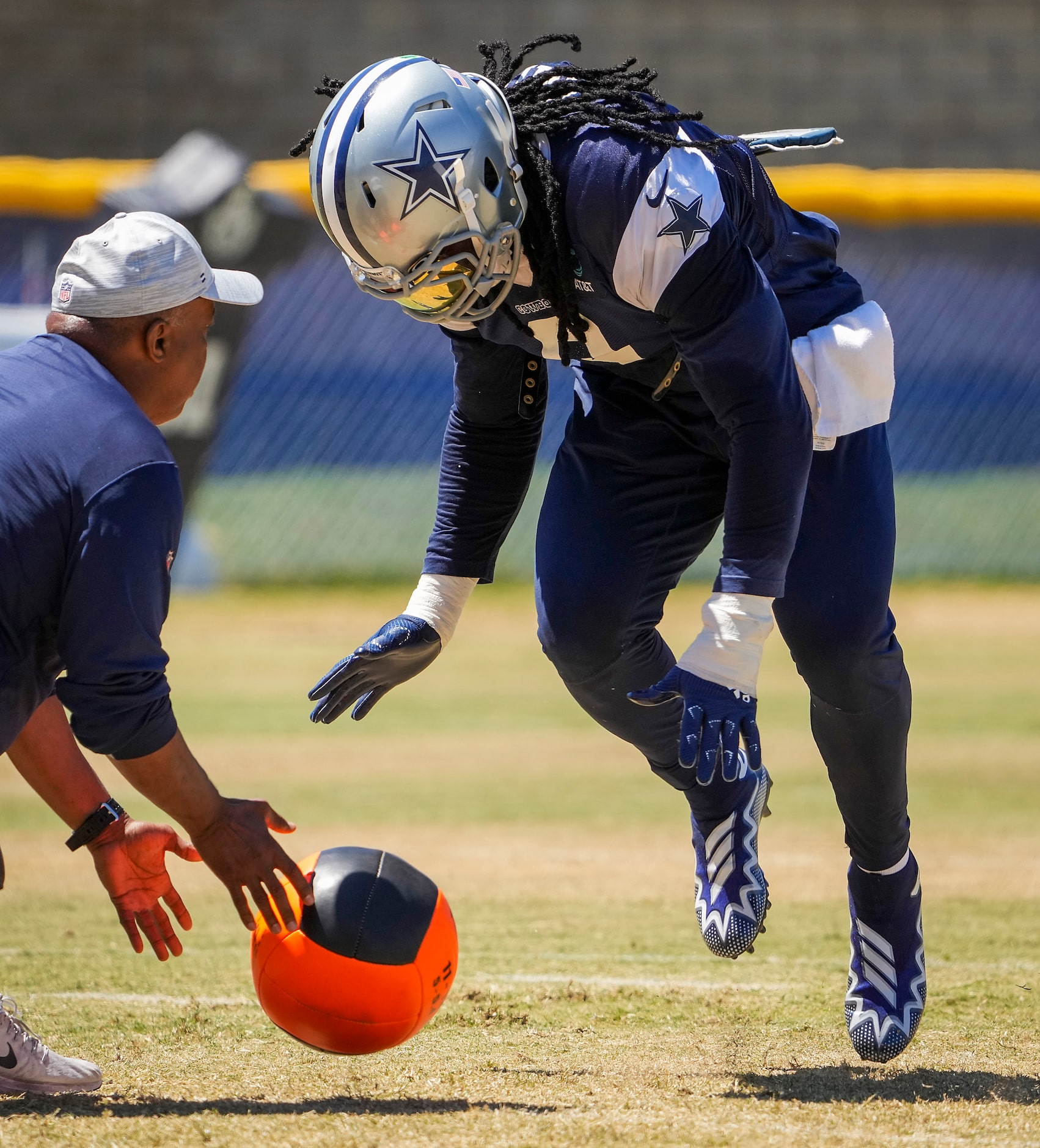 Dallas Cowboys linebacker Jaylon Smith (9) reaches for a medicine ball during a drill during...