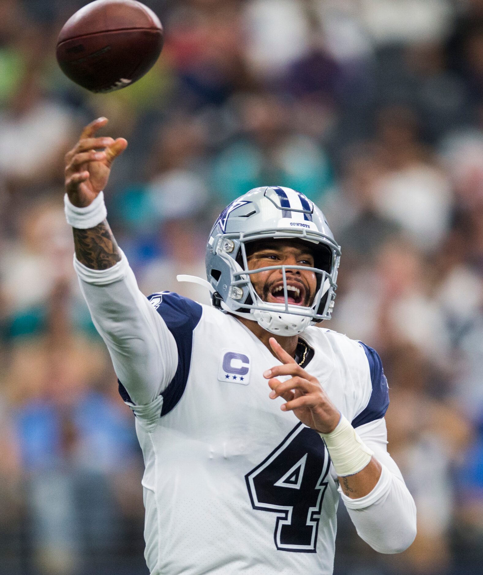 Dallas Cowboys quarterback Dak Prescott (4) throws a pass during the third quarter of an NFL...