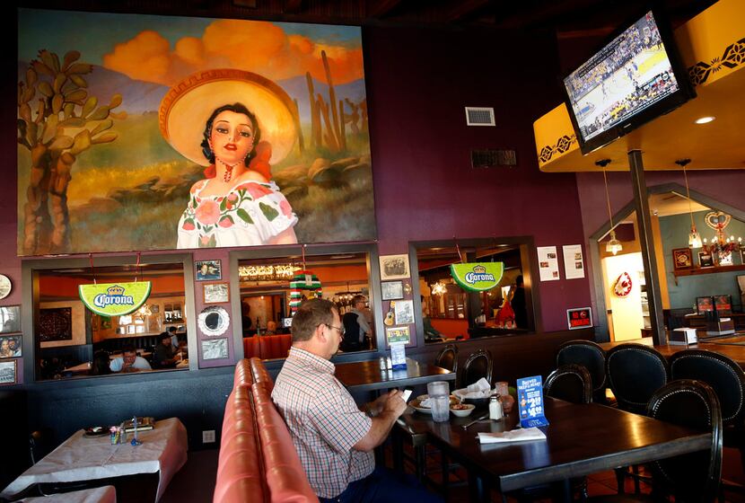 A large painting by Peggy Jones was moved from the original El Chico in the Bishop Arts...