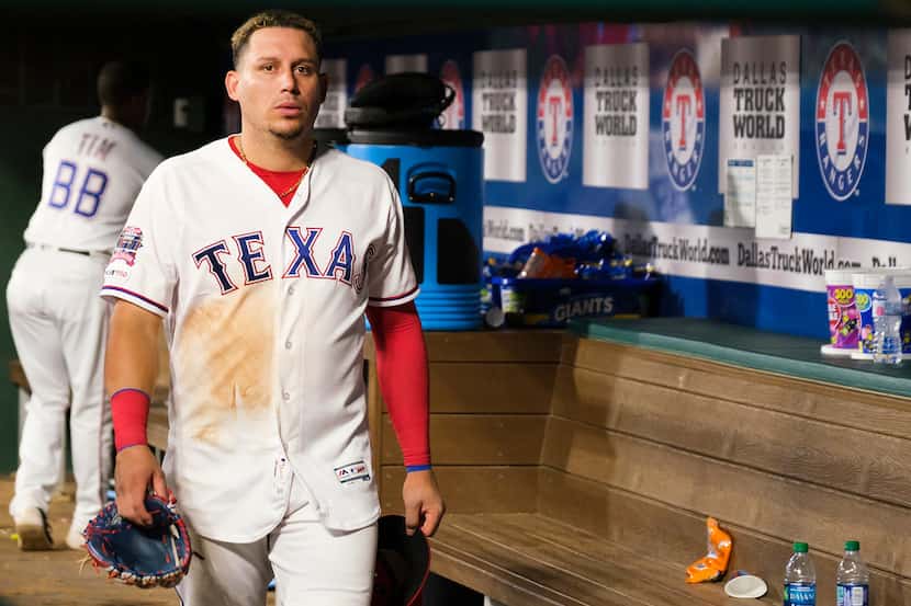Texas Rangers third baseman Asdrubal Cabrera  heads to the clubhouse after a 8-5 loss to the...
