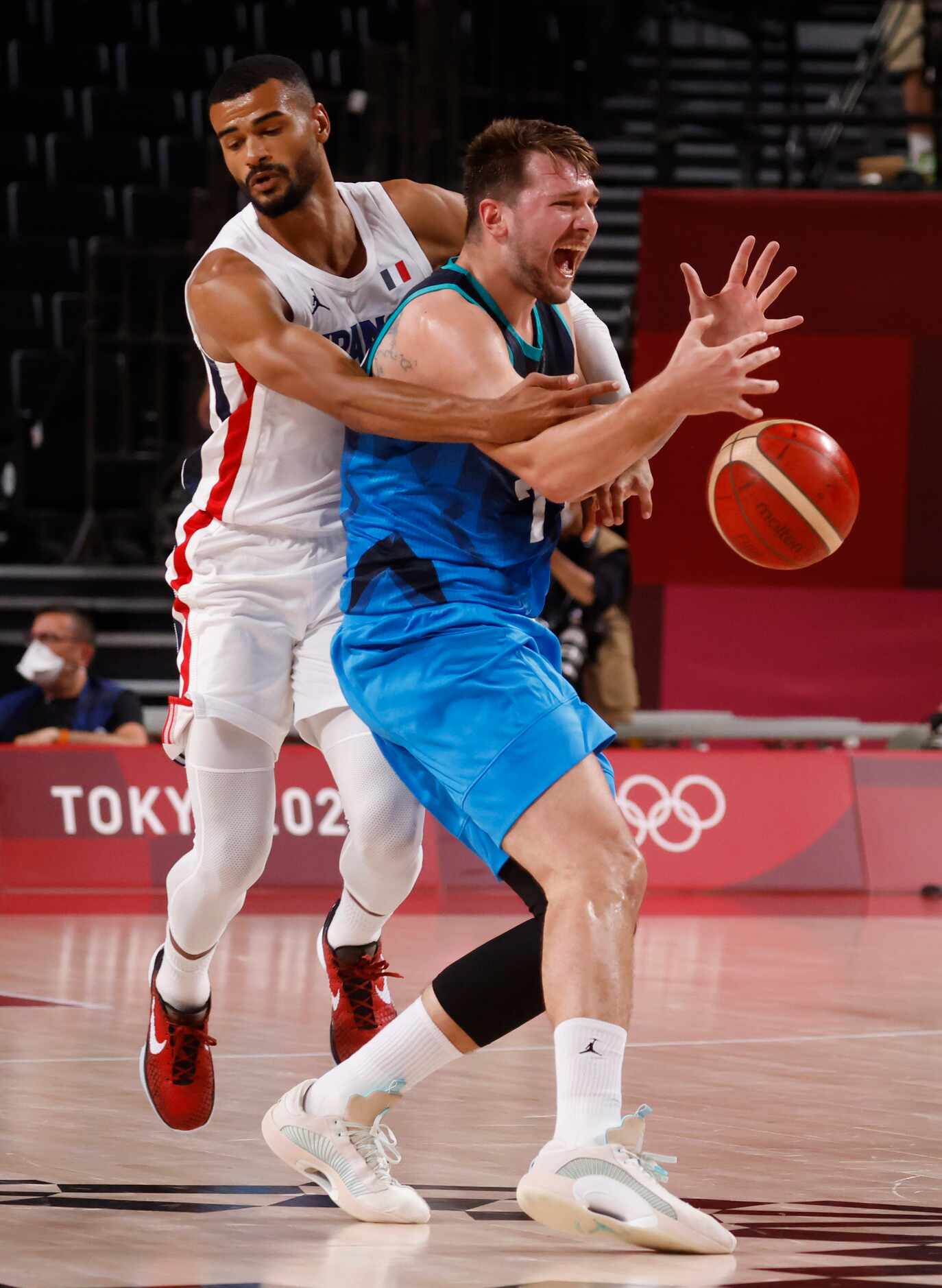 Slovenia’s Luka Doncic (77) is fouled by France’s Timothe Luwawu Cabarrot (3) during the...