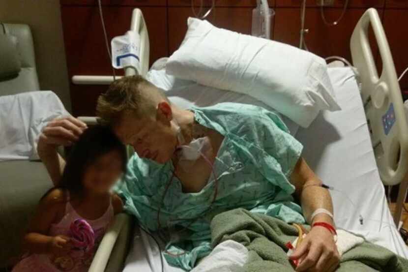 Gregory Epley Jr. in the hospital. His visitor's face was blurred at the family's request to...
