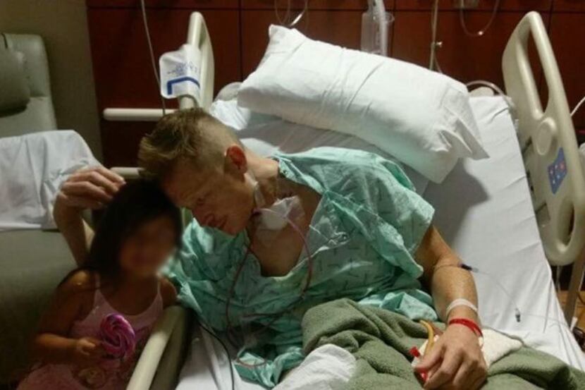 Gregory Epley Jr. in the hospital. His visitor's face was blurred at the family's request to...