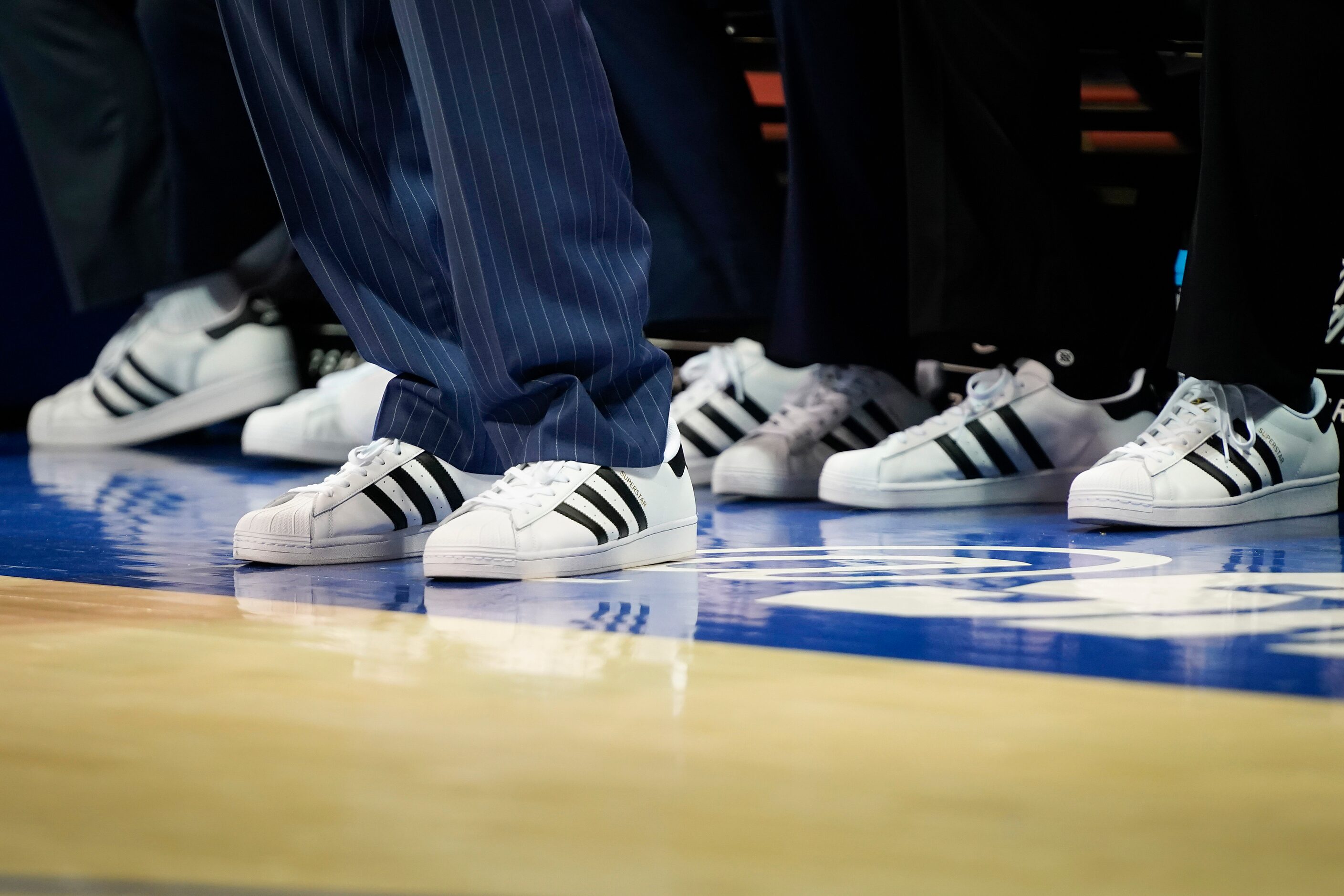 East Carolina coaches wear matching sneakers as part of Coaches vs. Cancer Suits And...