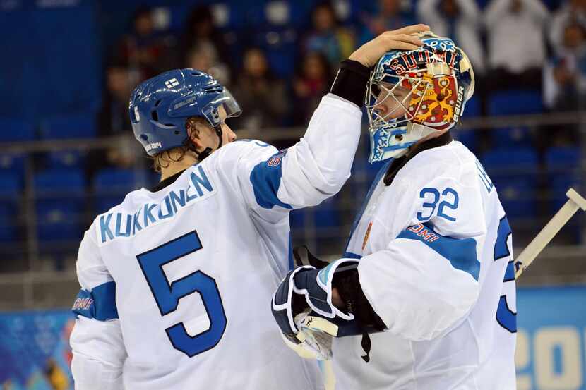 Feb 14, 2014; Sochi, RUSSIA; Finland goalie Kari Lehtonen (32) celebrates with defenseman...