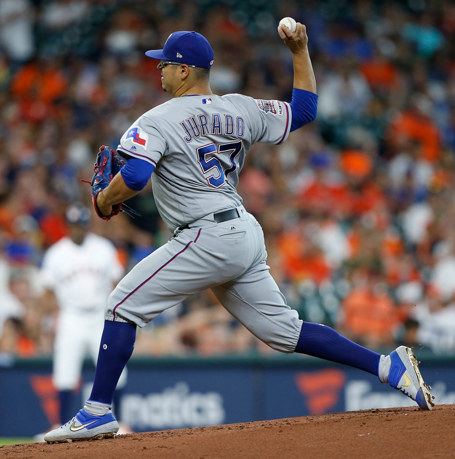 HOUSTON, TEXAS - JULY 20: Ariel Jurado #57 of the Texas Rangers pitches in the first inning...