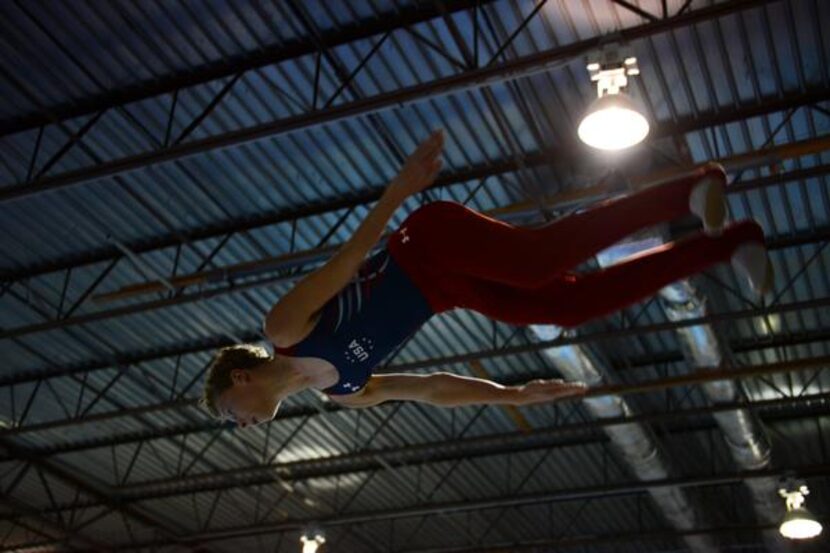 
Isaac Rowley practices his trampoline routine at Eagle’s Wings Athletics in Allen. Rowley...