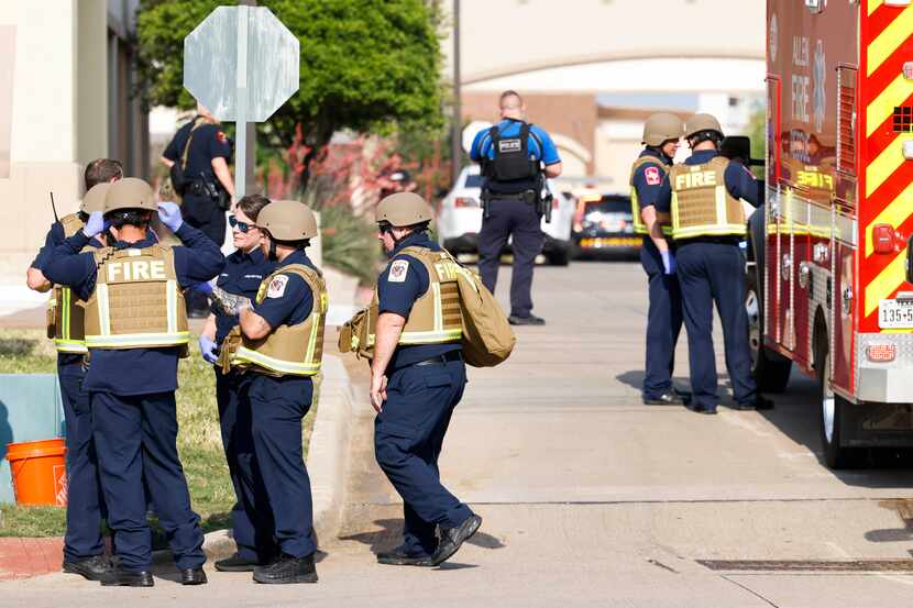 Law enforce authorities gather outside of the Allen Premium Outlets mall after a shooting...