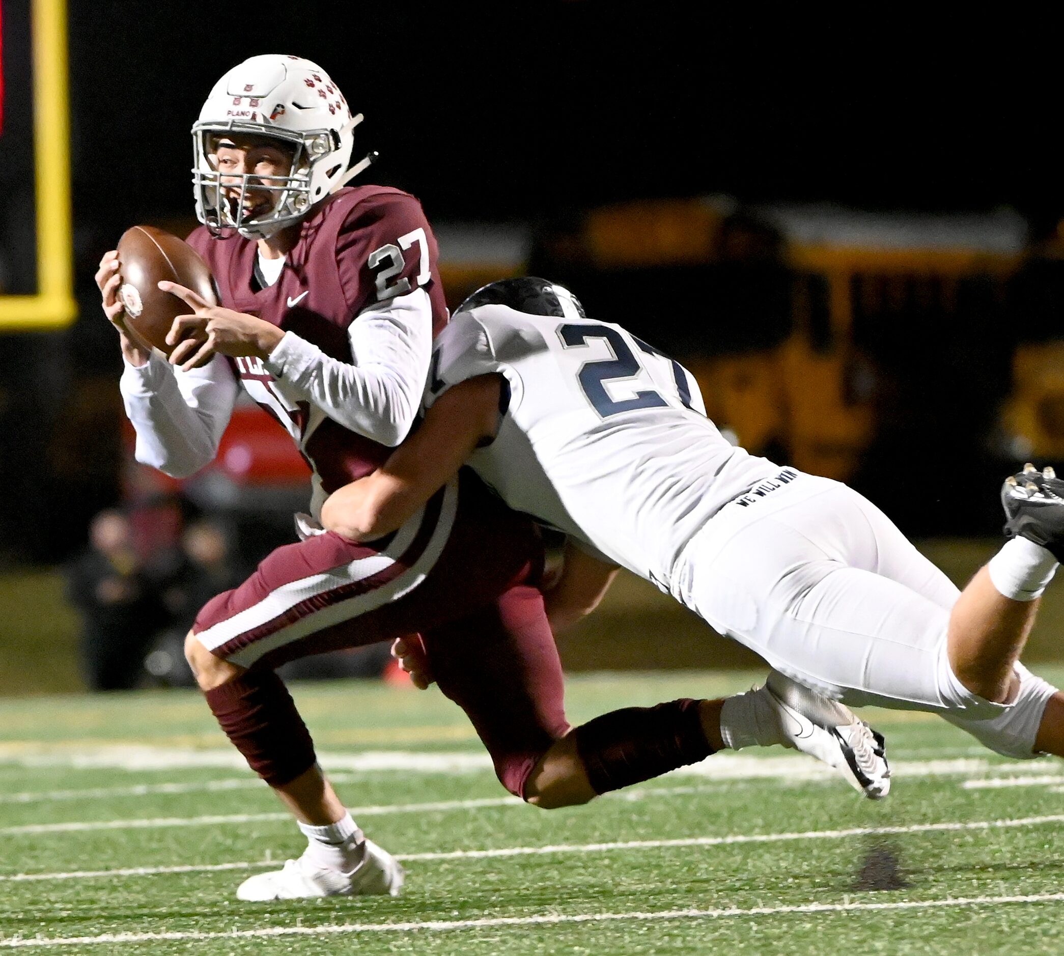 Plano quarterback Austin Gonzalez (27) is sacked by Flower Mound's Flower Mound's Rocco...