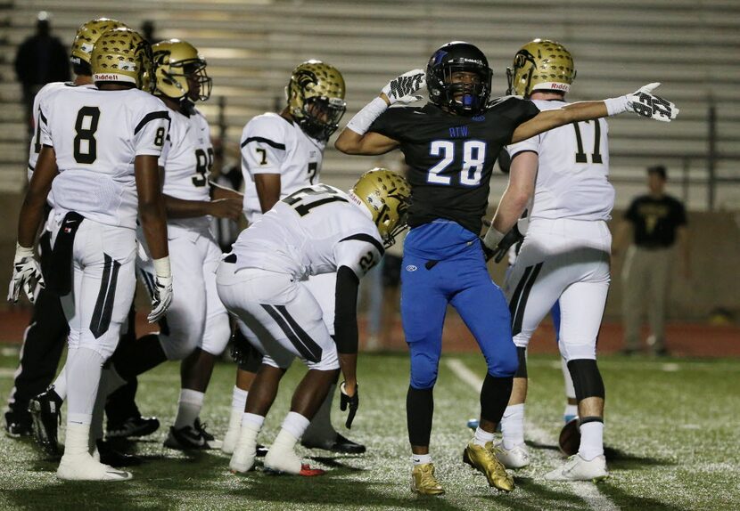 Hebron running back Derian Vaughn (28) celebrates after rushing for a first down in the...