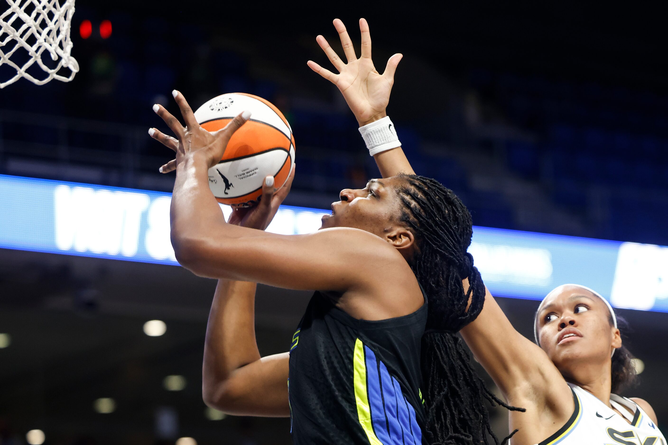 Dallas Wings center Teaira McCowan, left, drives to the basket as Chicago Sky forward Azura...