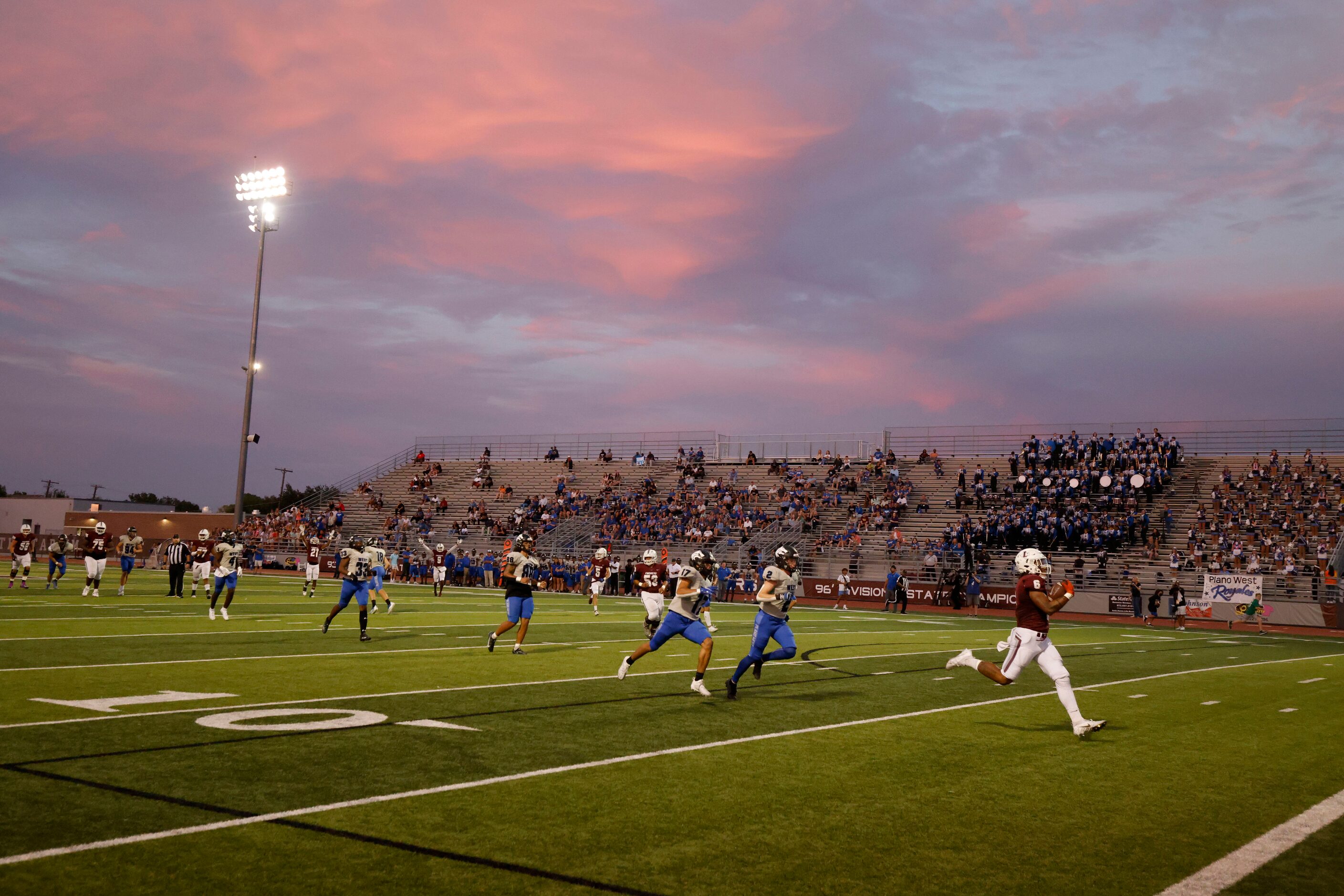 Lewisville running back Damien Martinez (6) scores a long touchdown as he is chased by Plano...