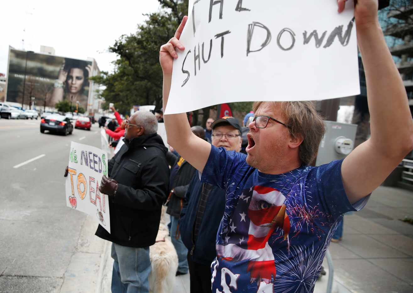 Charles Hermes yells during a rally protesting the partial government shutdown outside Ross...
