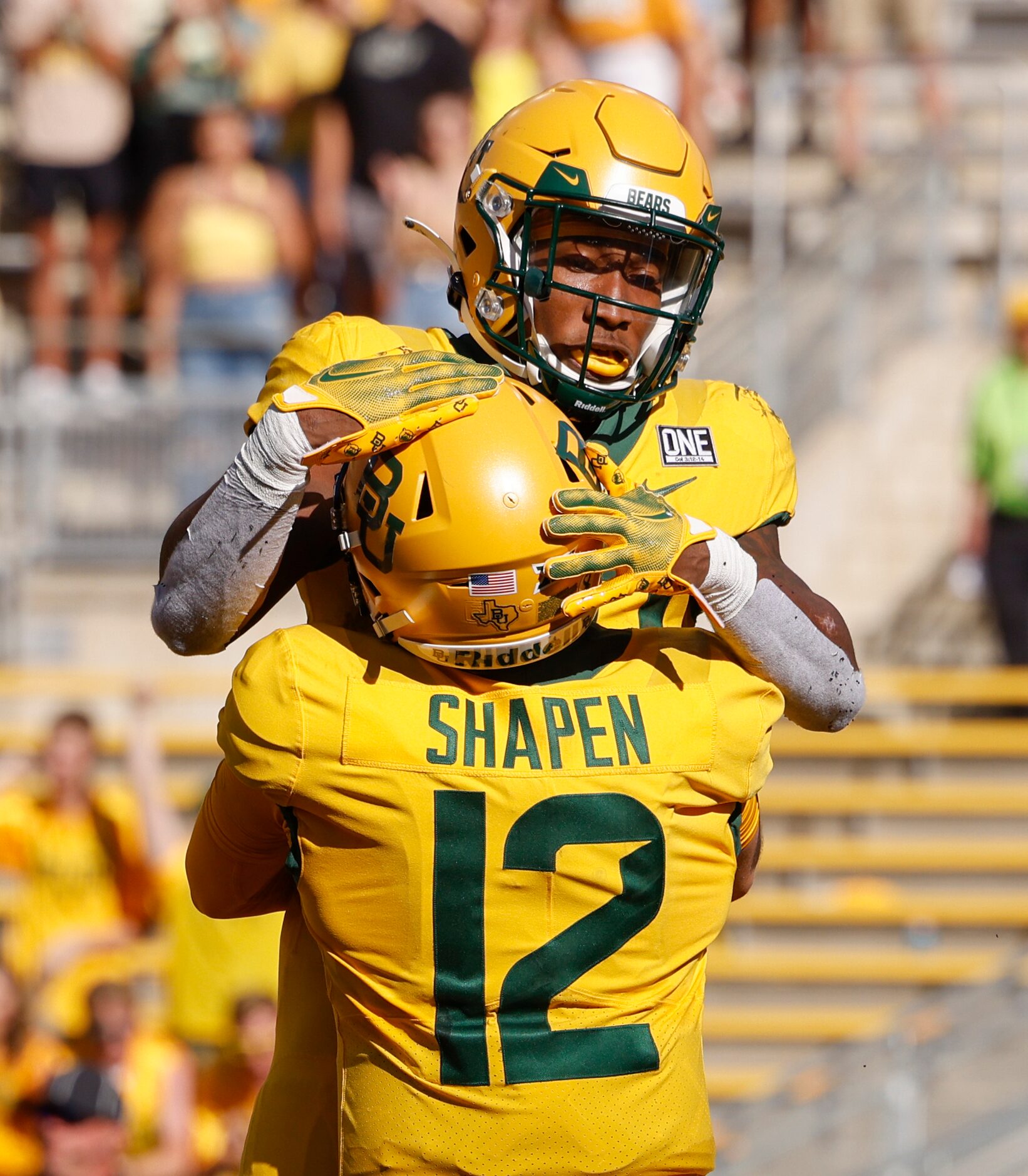 Baylor quarterback Blake Shapen (12) celebrates a touchdown with running back Richard Reese...