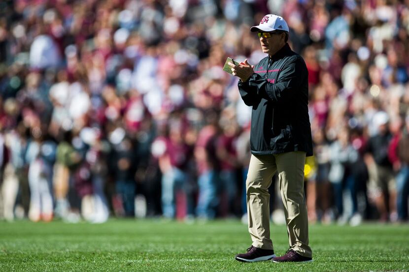 Texas A&M head coach Jimbo Fisher applauds his team during the first quarter of their Maroon...