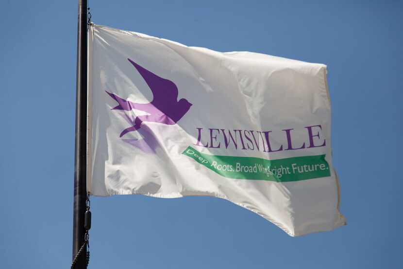 A waving flag near Lewisville City Hall.