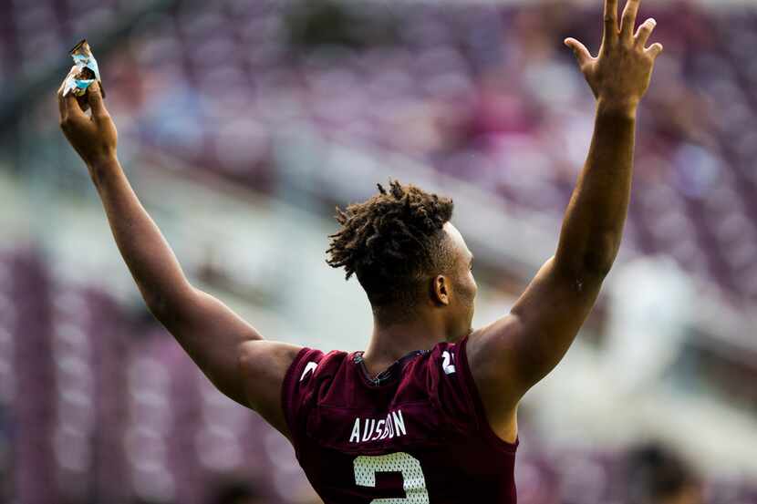 Texas A&M Aggies wide receiver Jhamon Ausbon (2) signals to other players during warm up...