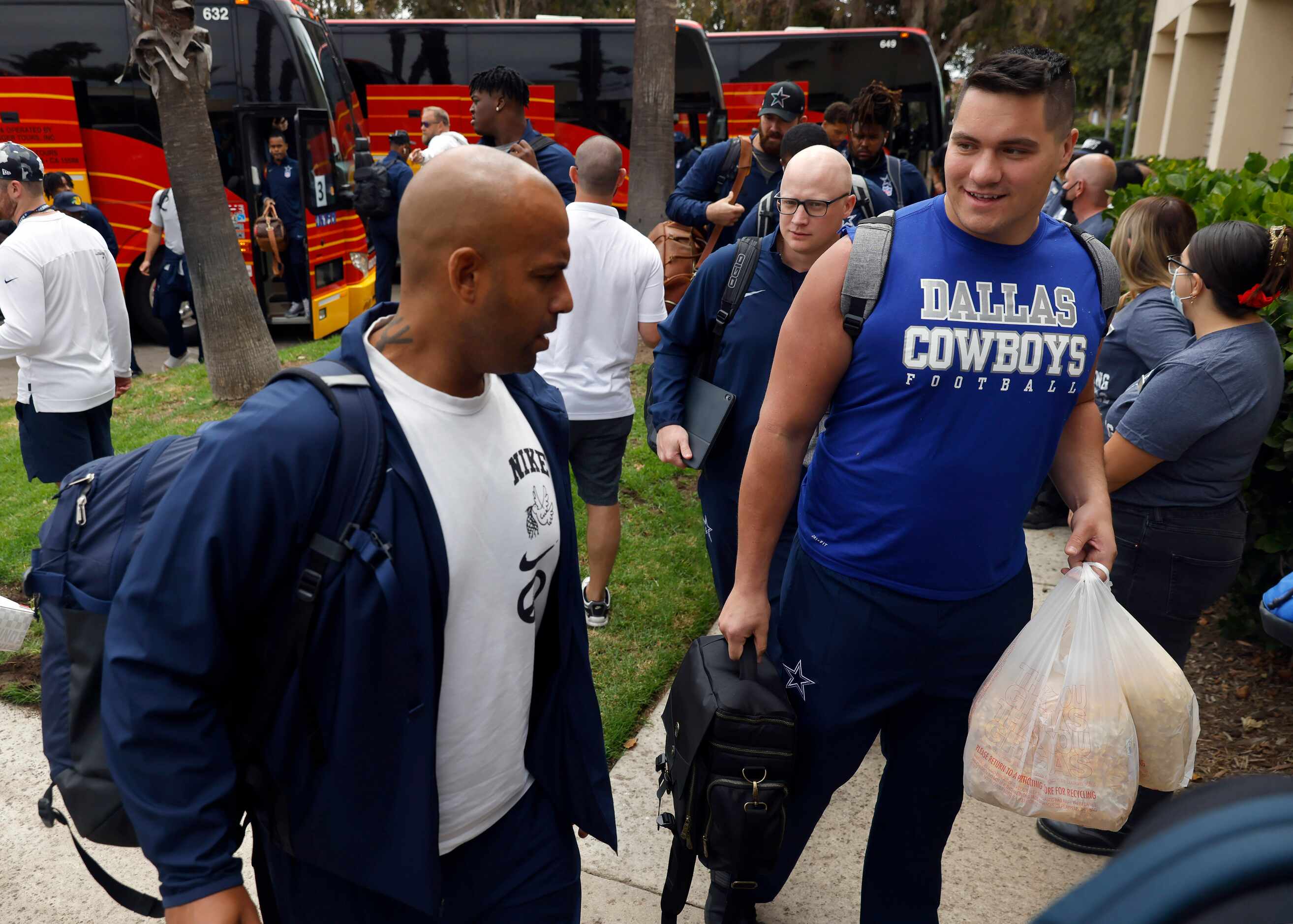 Dallas Cowboys defensive line coach Aden Durde (left) and fullback Ryan Nall (right) arrive...