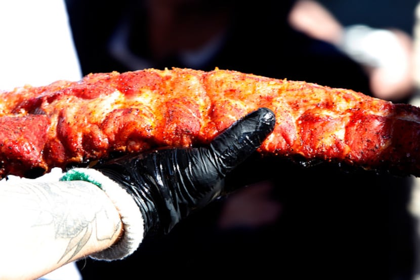 A large portion of brisket glows in the sun as Matt Pittman shares important details at his...