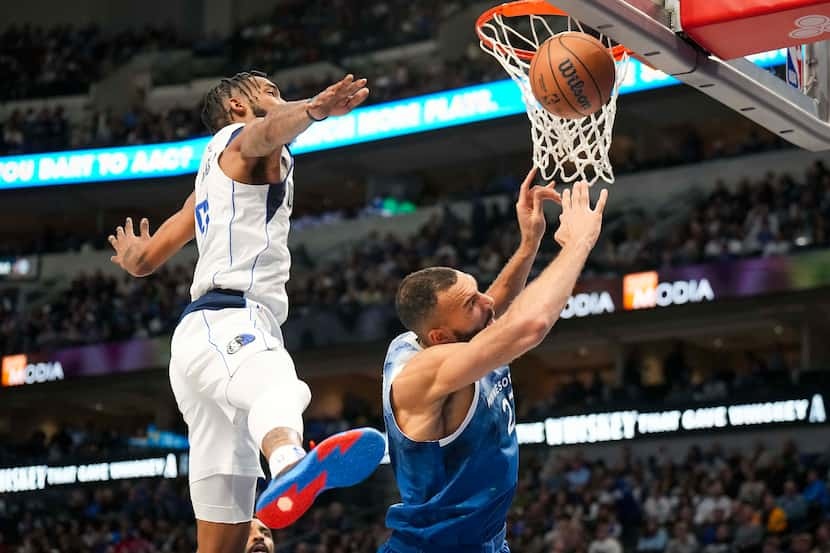 Dallas Mavericks forward Derrick Jones Jr. (55) blocks a shot by Minnesota Timberwolves...