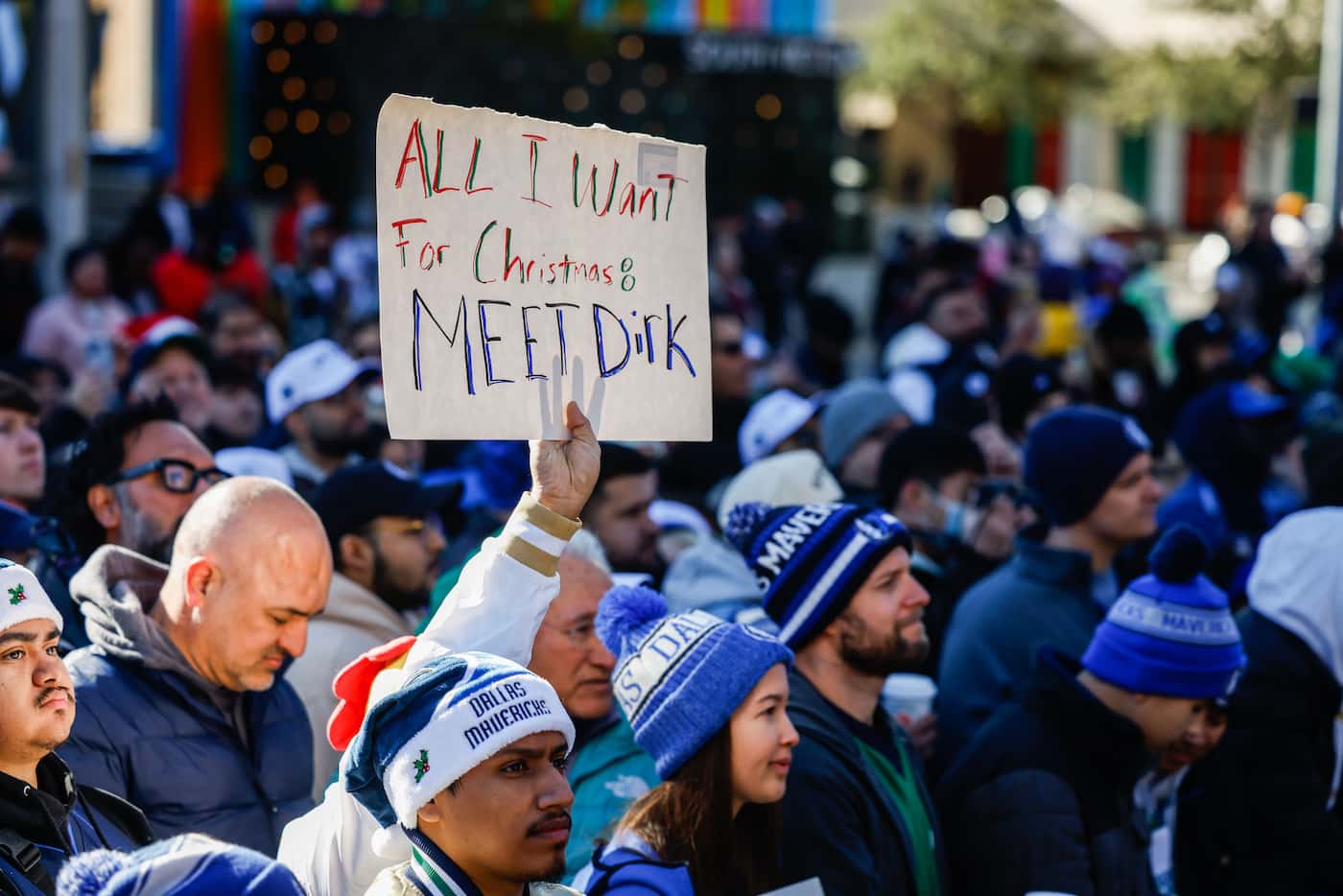 Fans gather around the plaza during a Christmas Day ceremony where Dirk Nowitzki statue is...