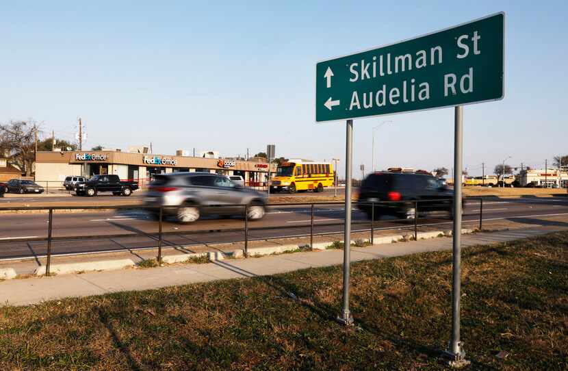 Vehicles travel north on Skillman Street near Interstate 635.  The split intersection of...