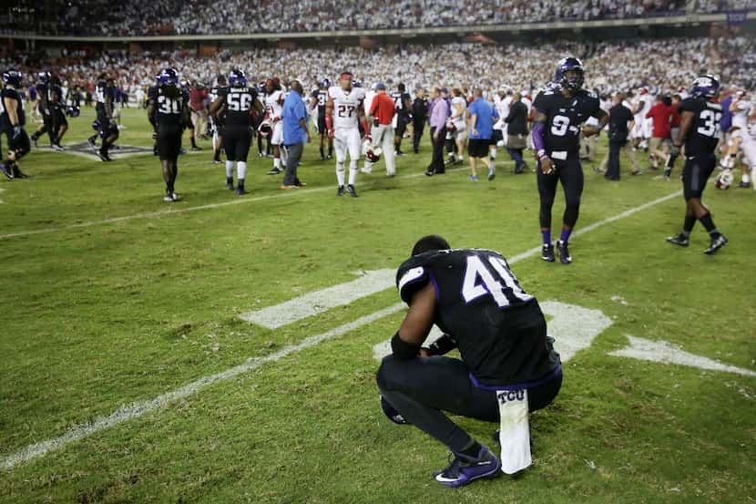 TCU defensive end James McFarland (40) reacts after losing in double overtime during an NCAA...